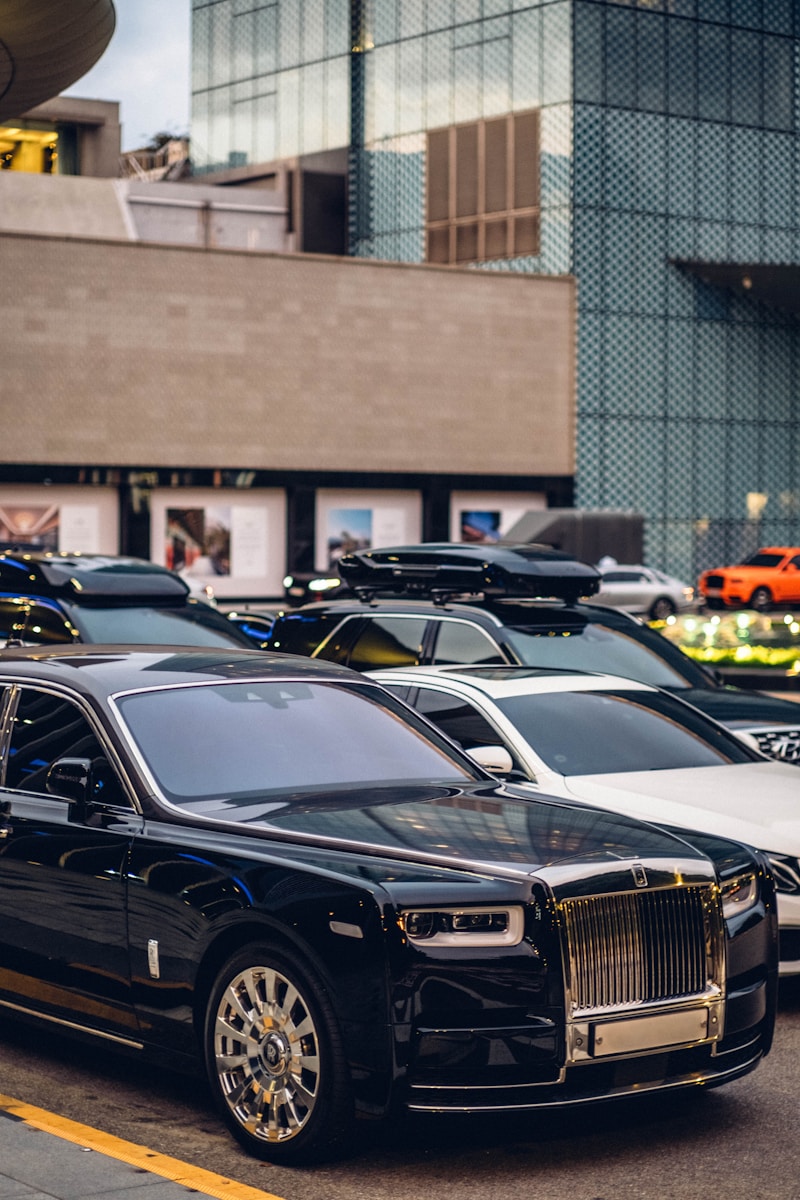 Luxury cars parked on a city street